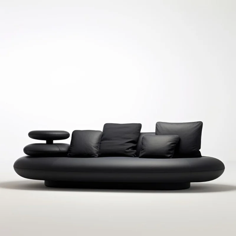 Czarna skórzana kanapa z zaokrąglonymi formami i zenowym spokojem